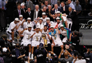 SAN ANTONIO, TX - JUNE 15:  The San Antonio Spurs celebrate with the Larry O'Brien trophy after defeating the Miami Heat to win the 2014 NBA Finals at the AT&T Center on June 15, 2014 in San Antonio, Texas. NOTE TO USER: User expressly acknowledges and agrees that, by downloading and or using this photograph, User is consenting to the terms and conditions of the Getty Images License Agreement.  (Photo by Chris Covatta/Getty Images)